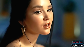 Sexy Asian MILF Malena gives a striptease for Playboy