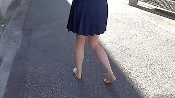 Girl walking outdoors barefoot