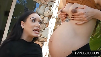 Pregnant girl feeds other girl breasts milk