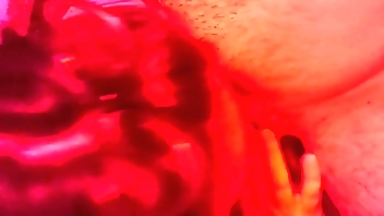 Hot MILF with big tits gives a blowjob in red light titty fucking and cumshot