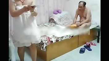 Chinese woman and her guy at the hotel