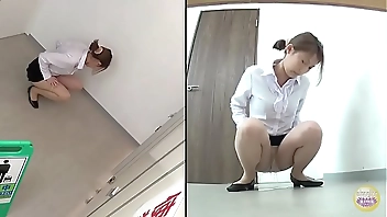 Japanese wetting herself in the bathroom