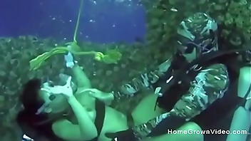 Fucking this busty cutie underwater while scuba diving