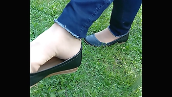shoeplay and dipping with tan nylons and flats