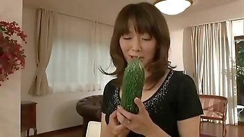 Japanese m. masturbating with a big cucumber