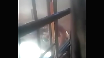 Beautiful teen, African student taking bath outside during daylight