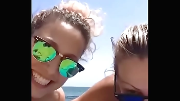 Couple of old women on the beach exhibitionist