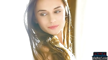 Perfect brunette babe gives a striptease and poses