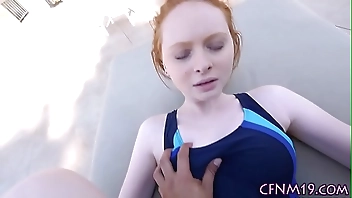 Clothed redhead takes cum
