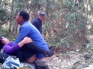 Naughty Chinese whore takes two dicks and swallows spunk in open-air XXX fun